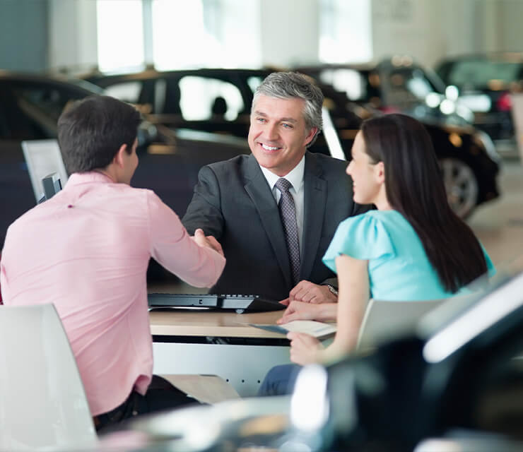 Handshake in car dealership